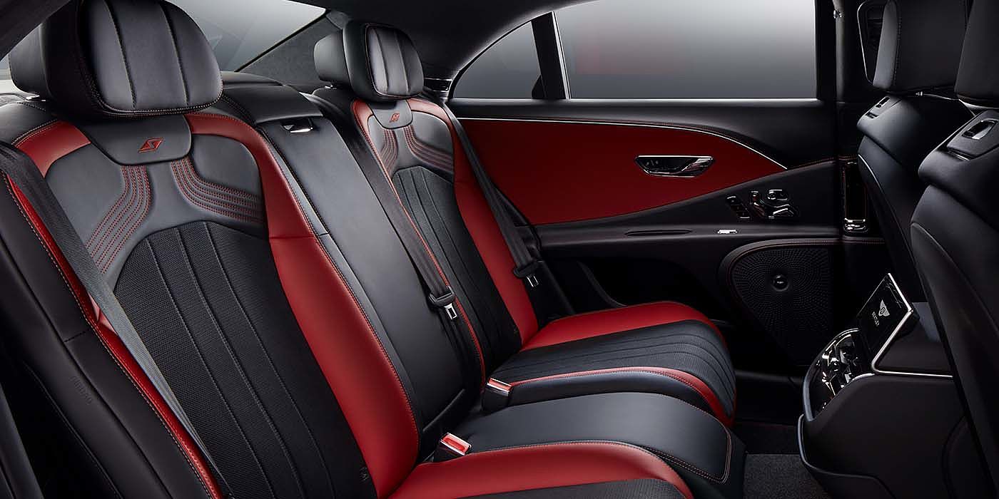 Bentley Santiago Bentley Flying Spur S sedan rear interior in Beluga black and Hotspur red hide with S stitching