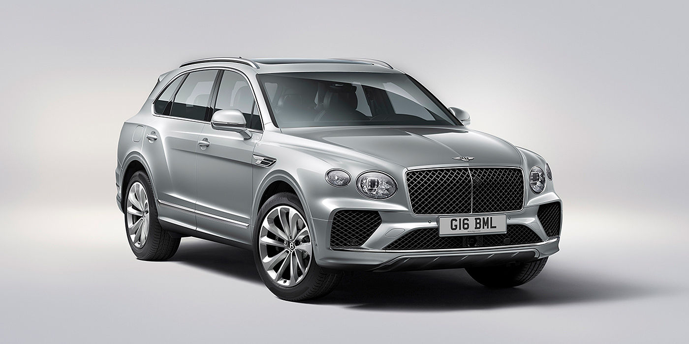 Bentley Santiago Bentley Bentayga in Moonbeam paint, front three-quarter view, featuring a matrix grille and elliptical LED headlights.