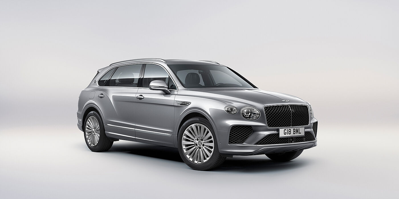 Bentley Santiago Bentley Bentayga Extended Wheelbase luxury SUV front three quarter view in Moonbeam paint with 21 inch five spoke painted wheels