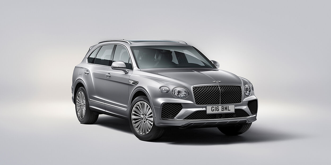 Bentley Santiago Bentley Bentayga luxury SUV front three quarter view in Moonbeam paint with matrix grille and 21″ 5 spoke painted wheels
