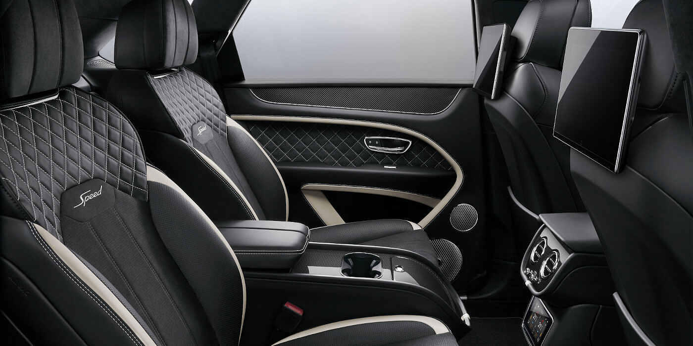Bentley Santiago Bentley Bentayga Speed SUV rear interior in Beluga black and Linen hide with carbon fibre veneer