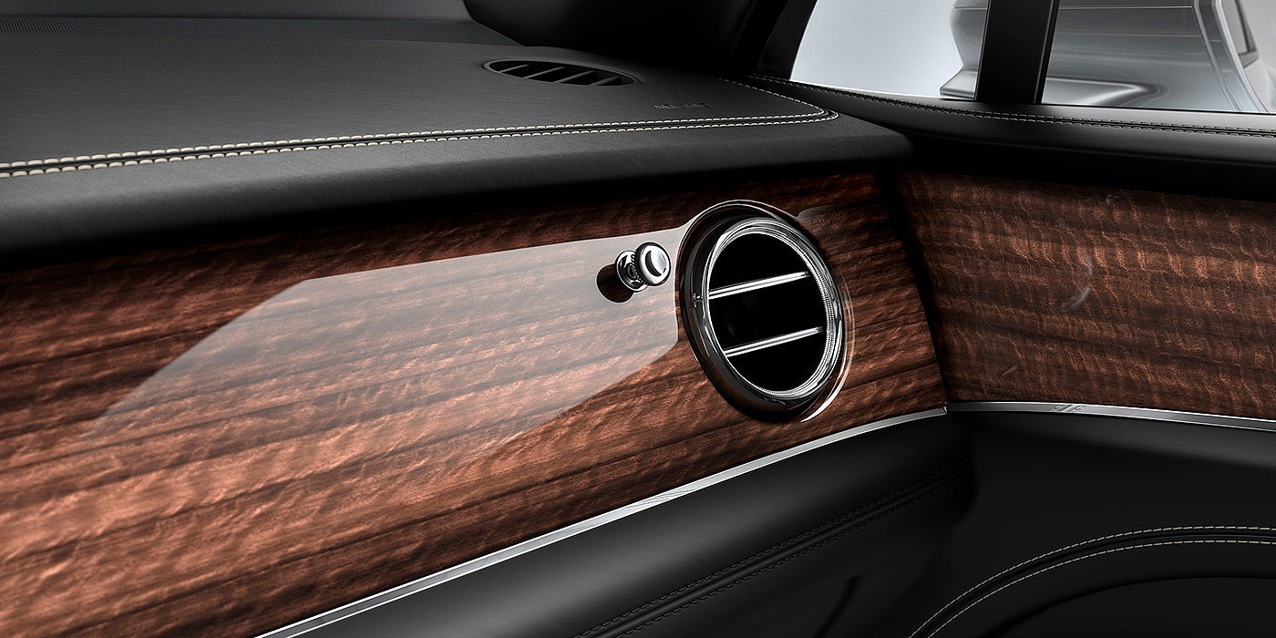 Bentley Santiago Bentley Bentayga front interior Crown Cut Walnut veneer and chrome air vent.