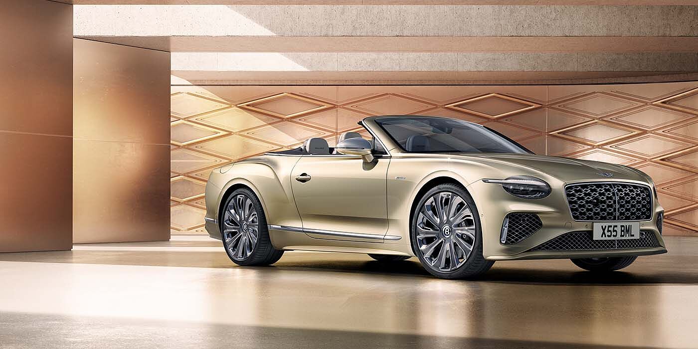 Bentley Santiago Bentley New Continental GTC Mulliner V8 hybrid front three quarters in Patina paint