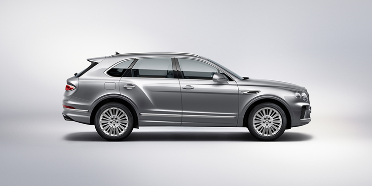 Bentley Santiago Bentley Bentayga SUV side profile in Moonbeam silver paint against white background featuring 21 inch 5 spoke wheels